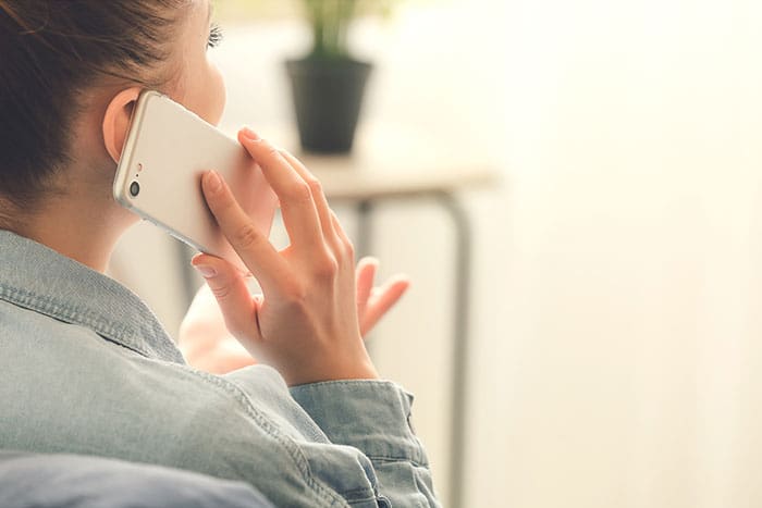 a female talking with her doctor during a Telehealth consultation
