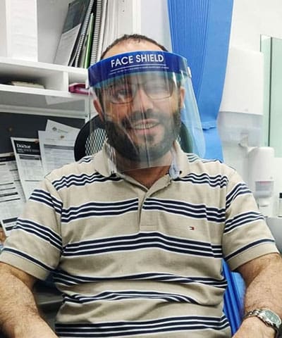 Dr. Tariq Hayat Jamaldini wearing face shield during covid-19